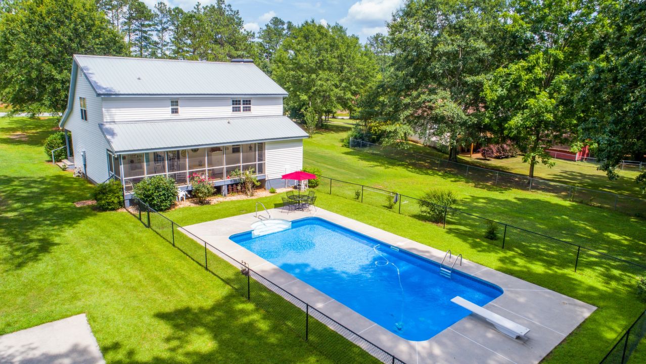 Back of House, In Ground Pool, & Deck