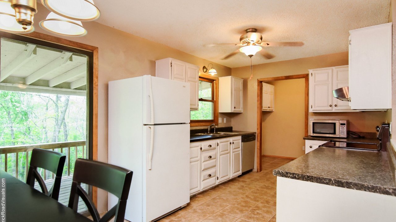 Kitchen is bright w/ access to the deck 