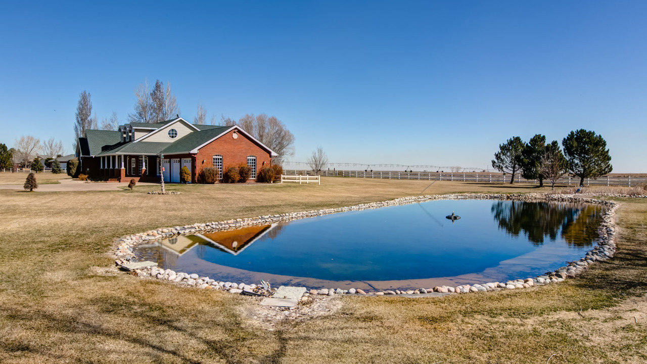 Side of Home with Pond