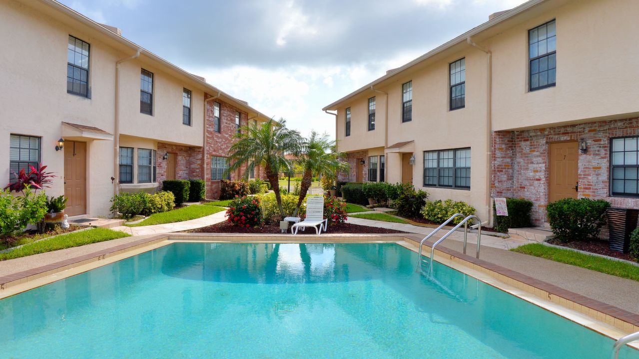 A VIEW OF THE CONDO FROM THE POOL