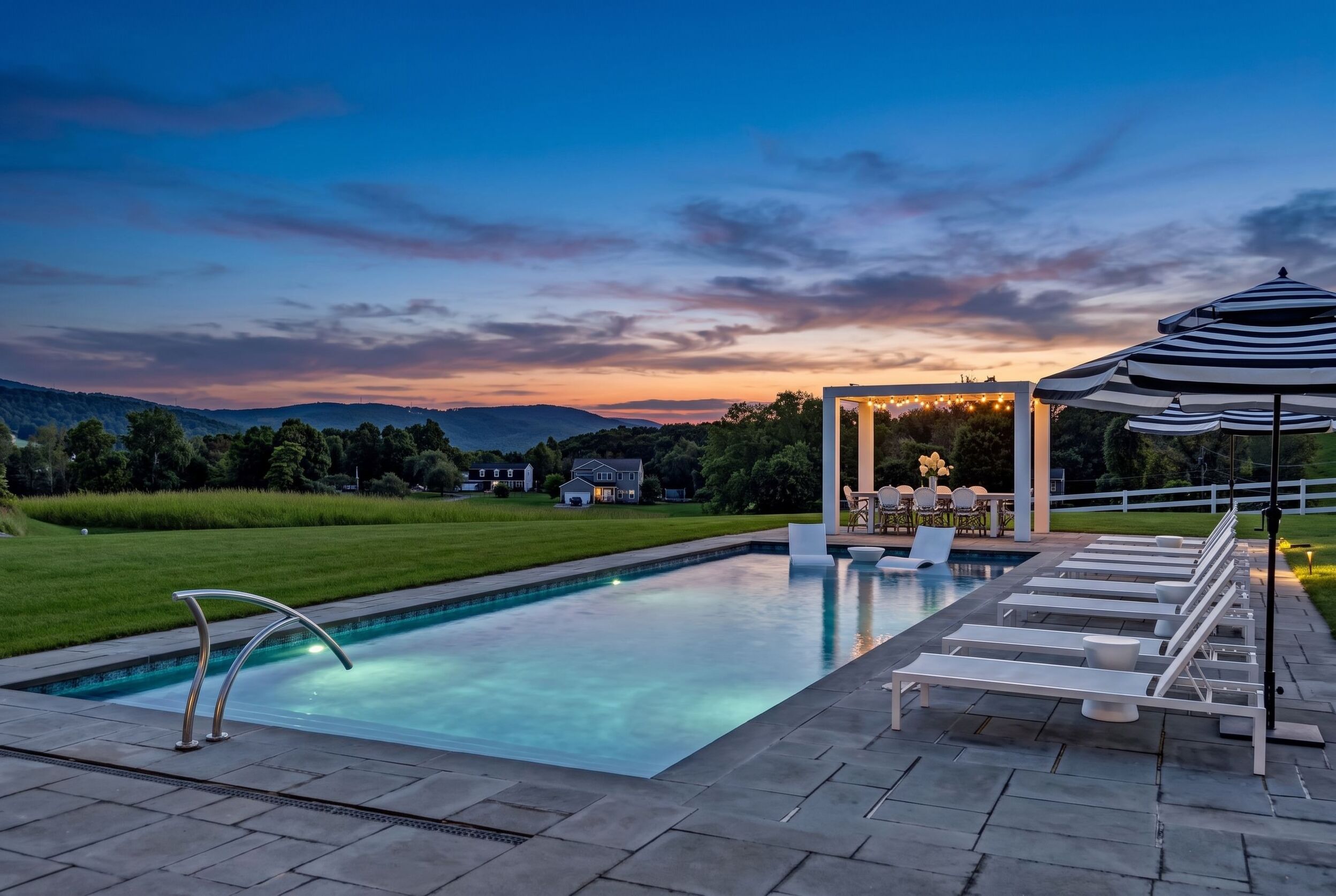 Pool at sunset with lounge terrace