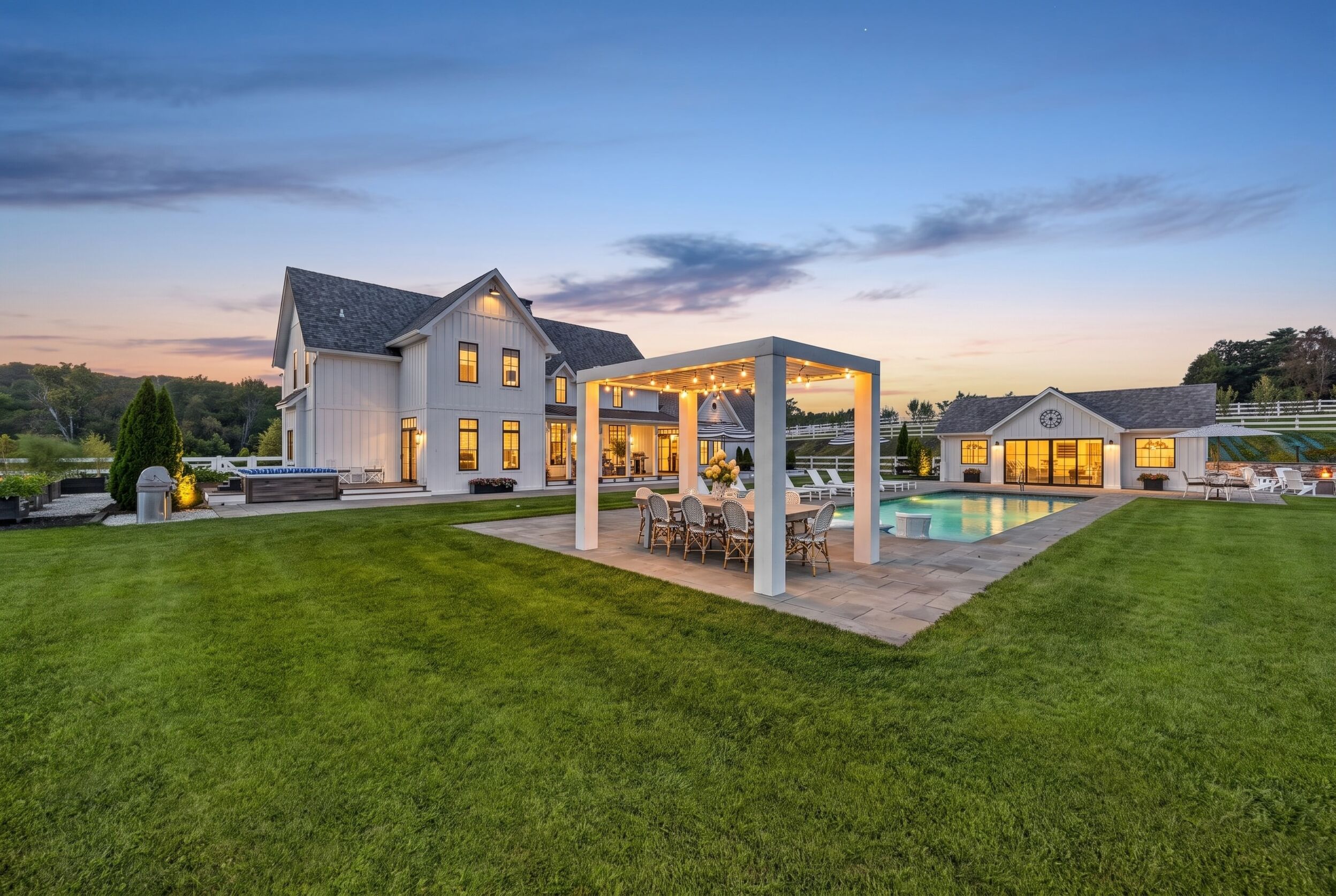 Pavilion and outdoor kitchen beside the pool lawn