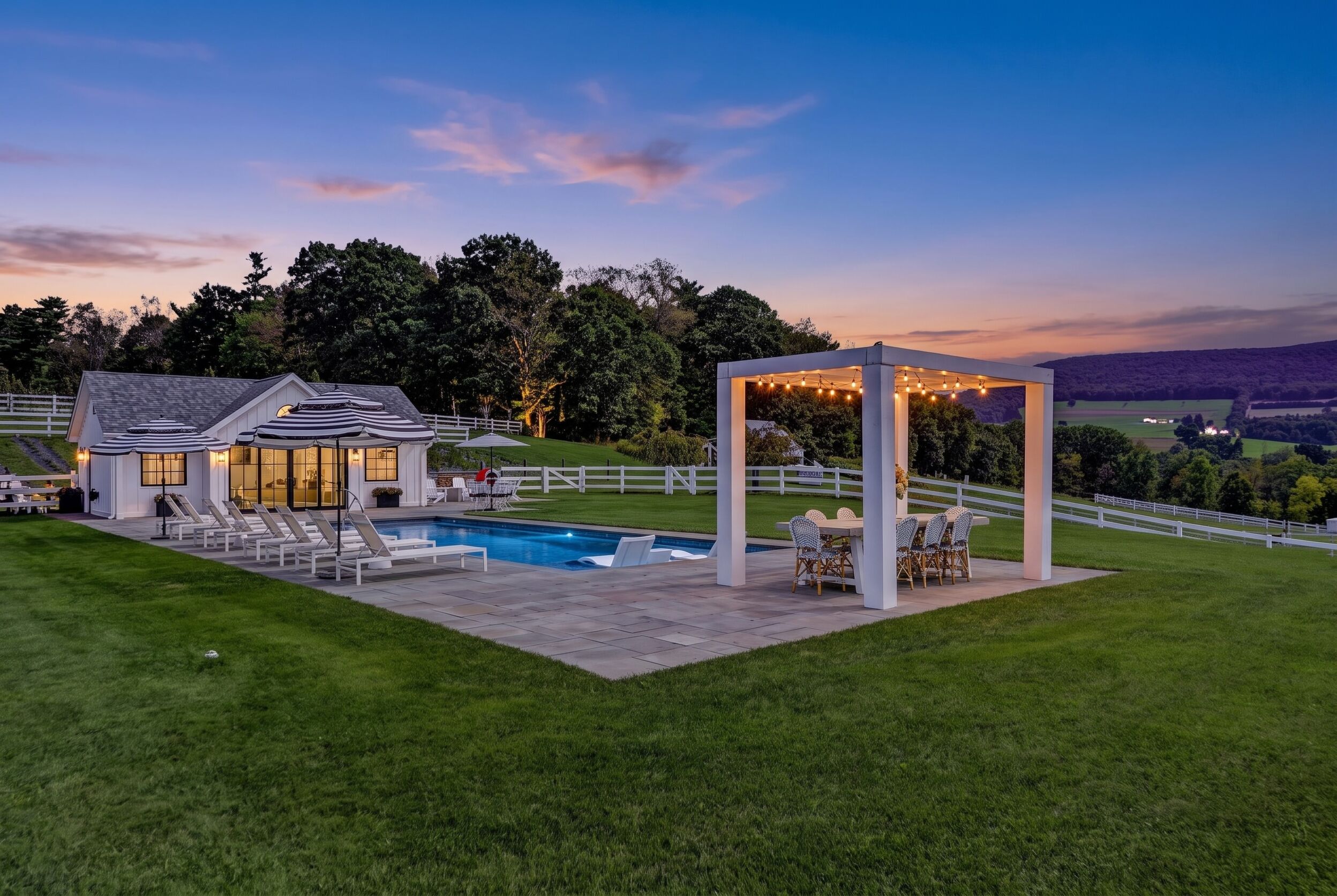 Modern pergola overlooking the pool at dusk