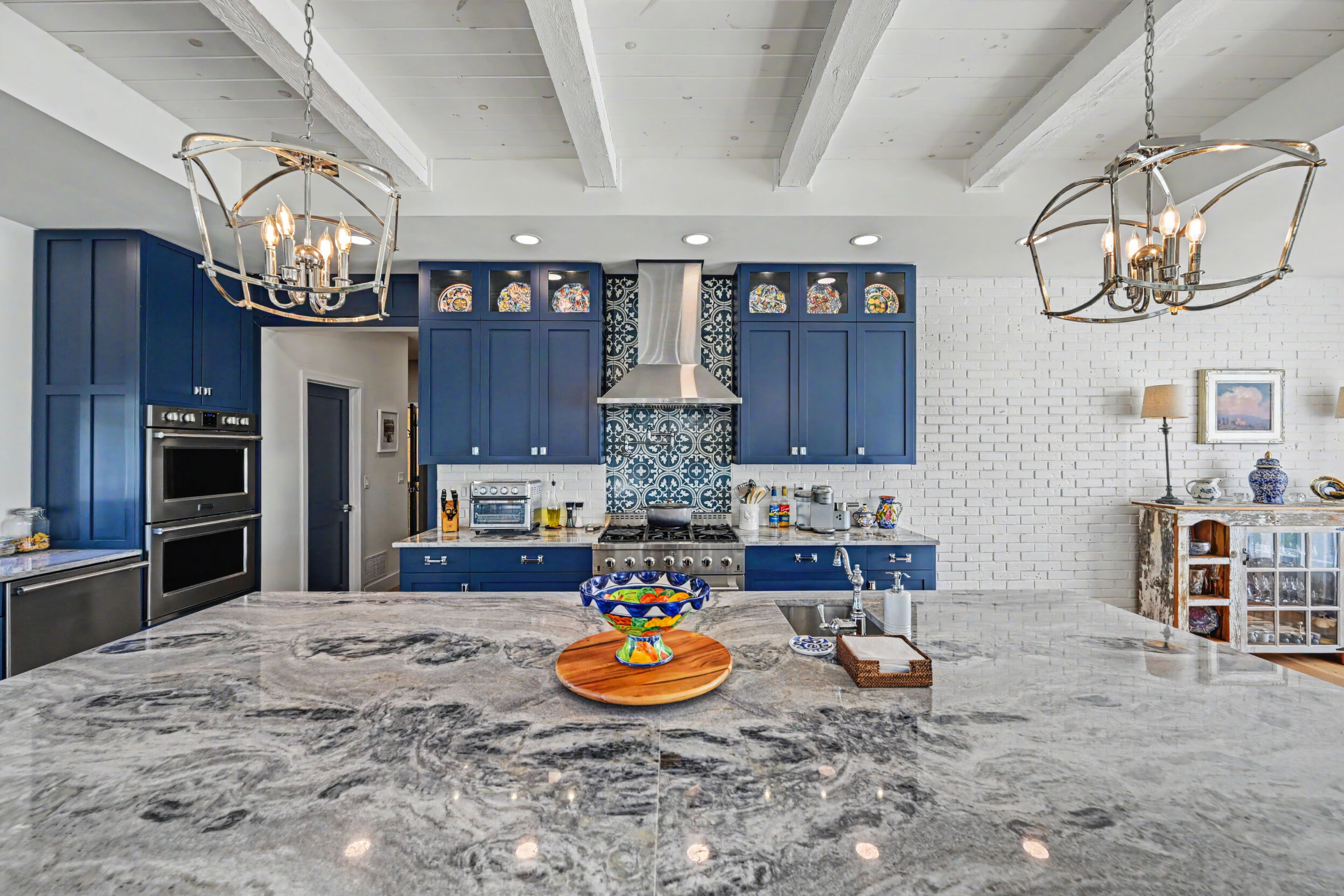 Quartzite countertops and painted-maple cabinetry