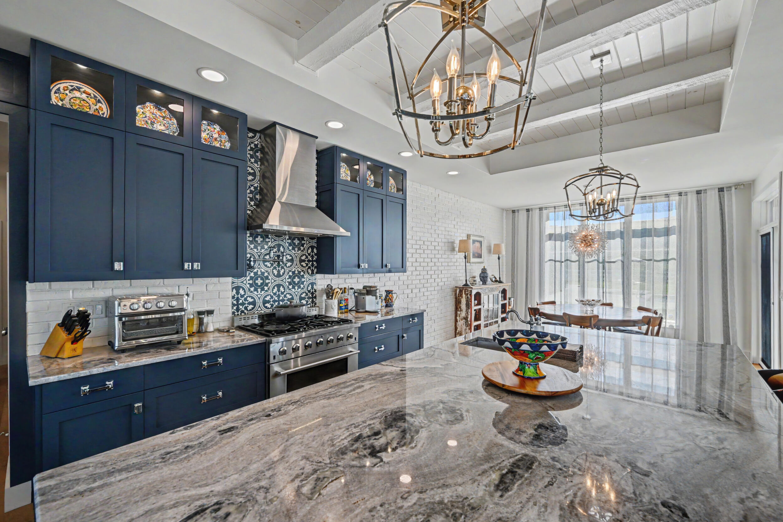 Professional range, hood and cement-tile backsplash