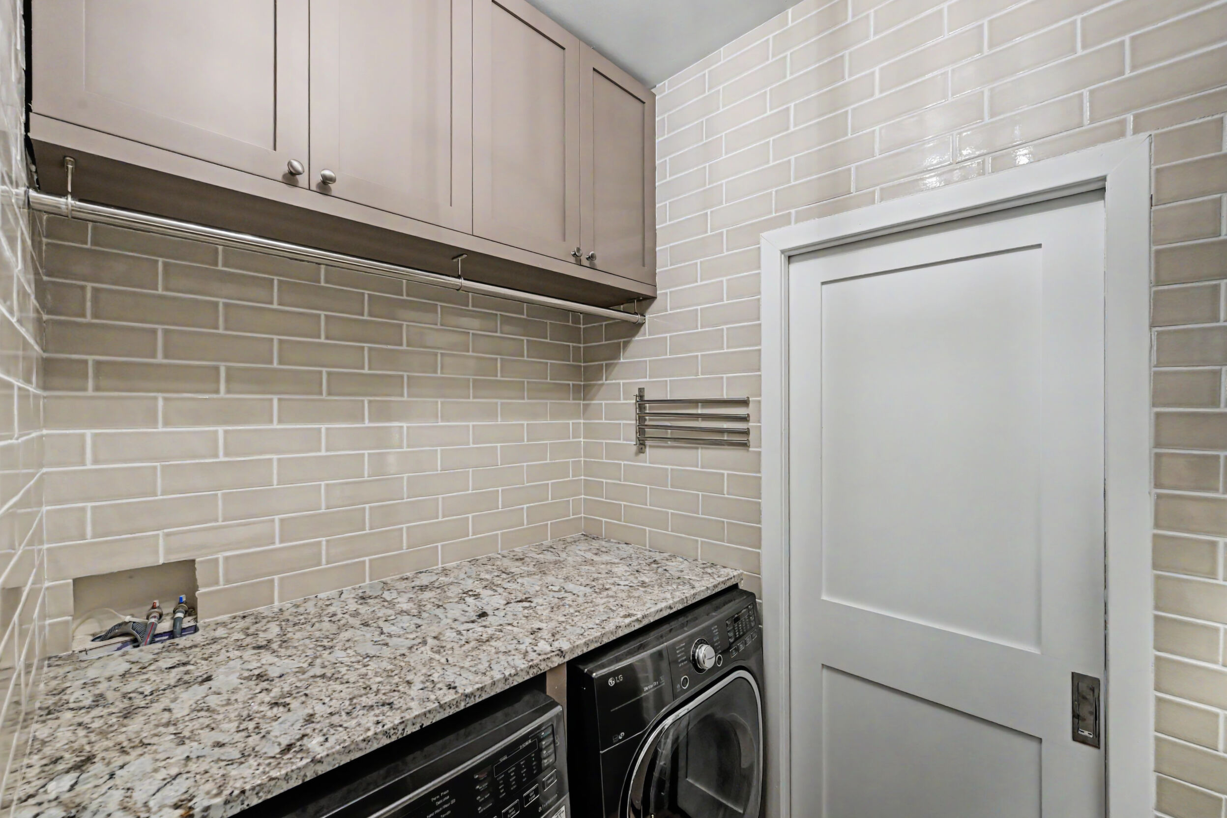 Laundry room with granite folding station