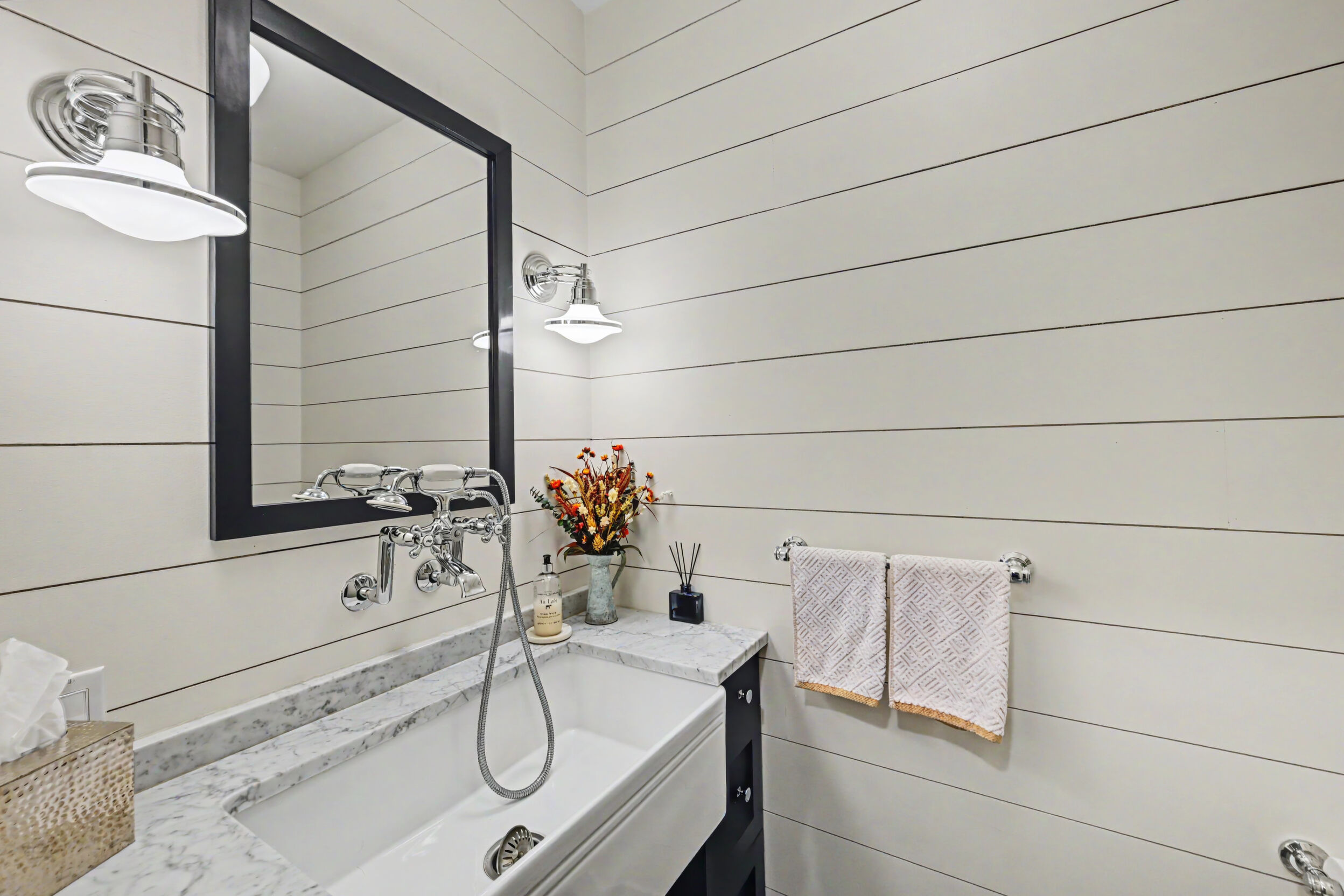 Mudroom powder room with farmhouse sink and dog-wash station