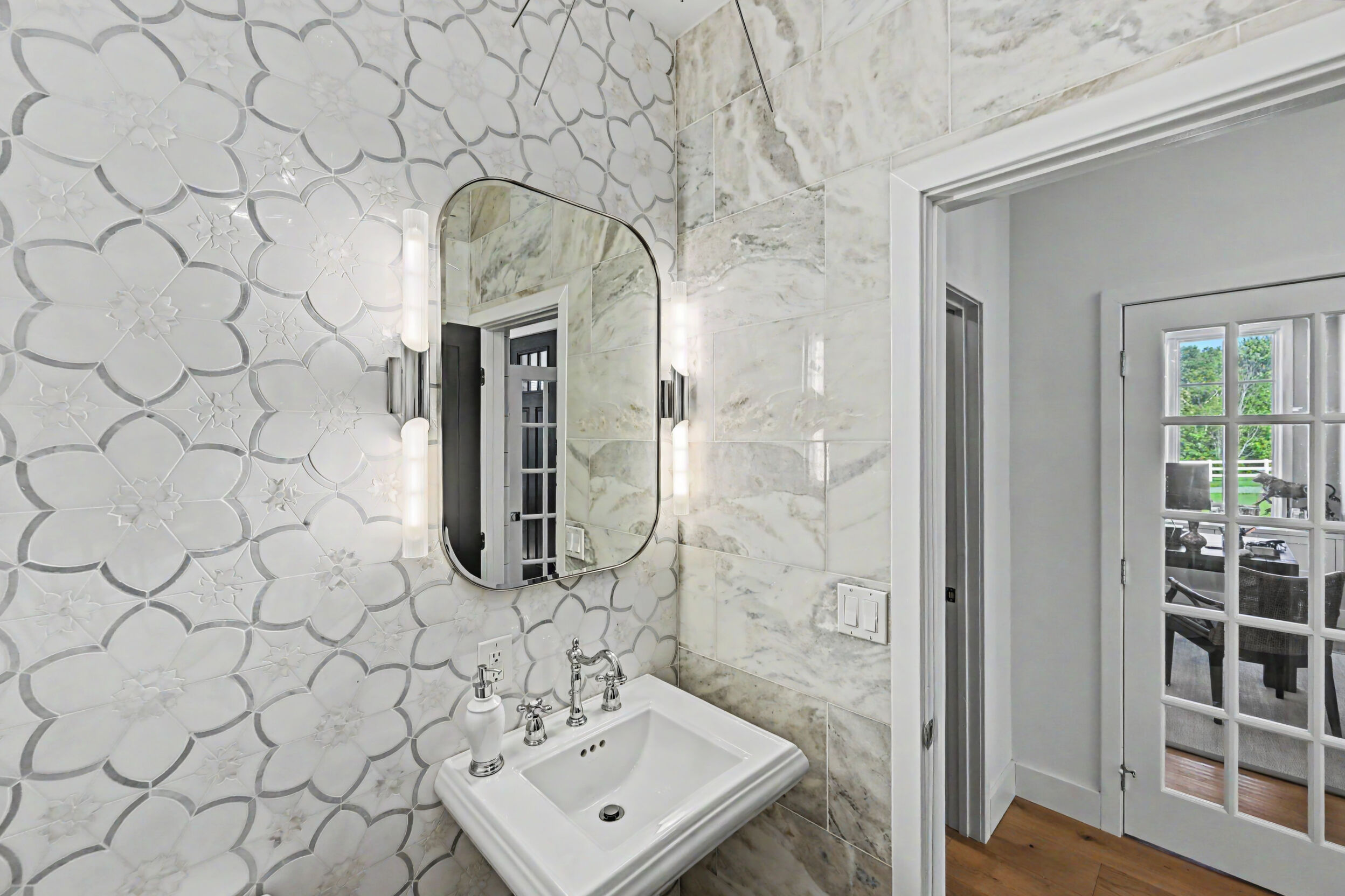 Powder room with marble mosaic accent wall
