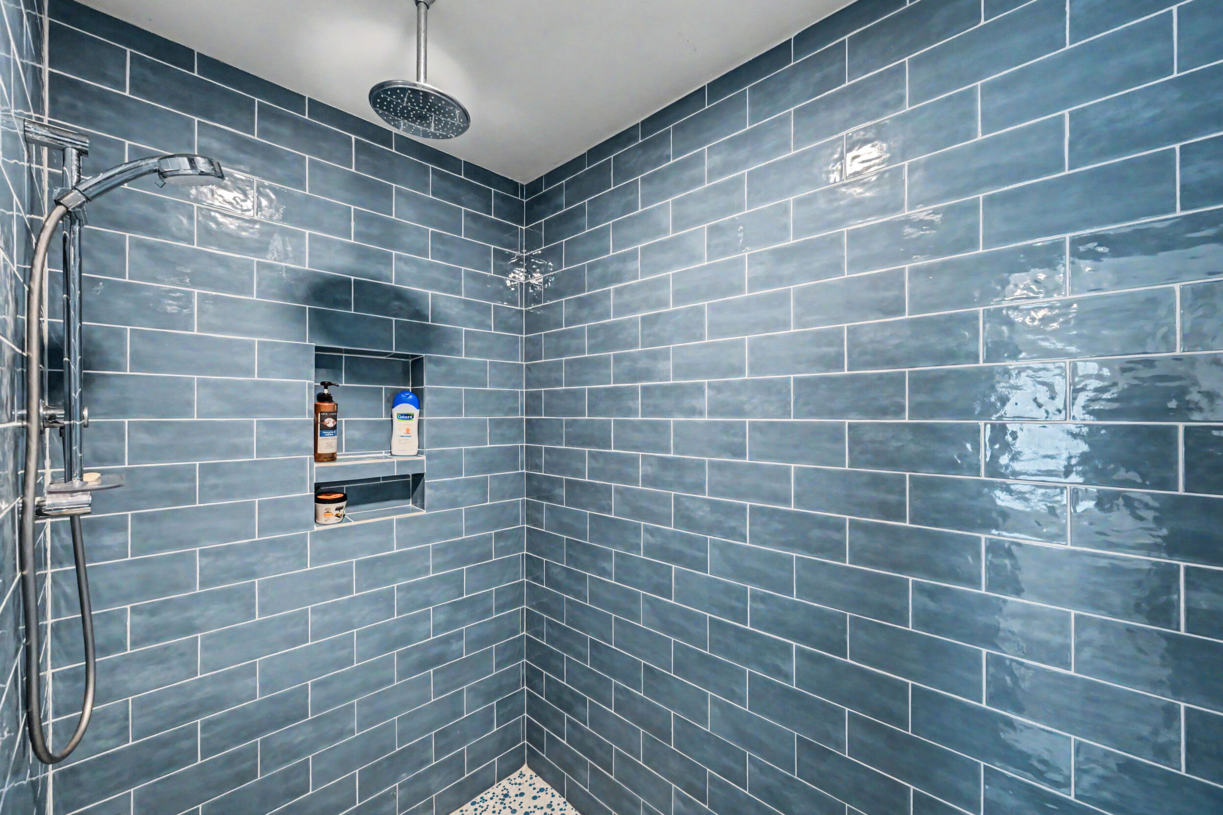 Tiled walk-in shower with rain head