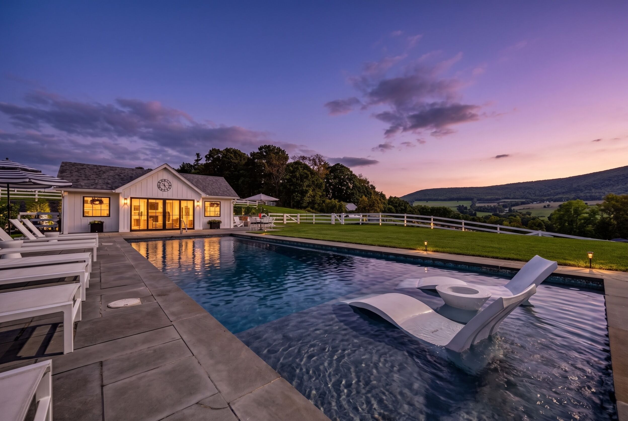 Pool and residence at sunset
