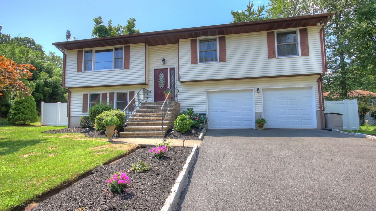 Welcome To This Beautifully Updated Bi-Level Home