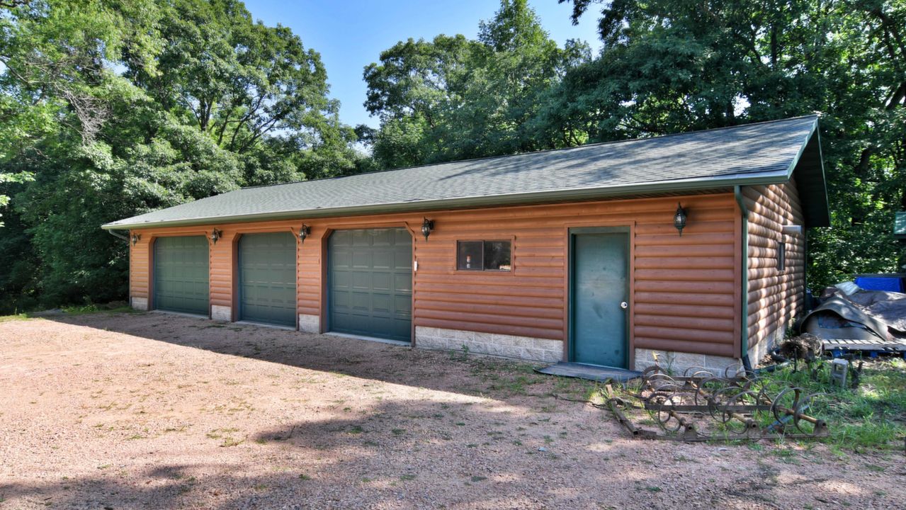 3 car garage with a heated workshop